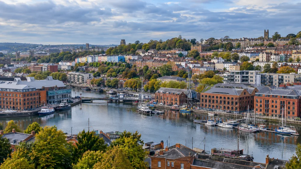 Bristol harbourside with brick warehouses and colourful terraced buildings